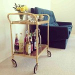 Not the barcart but that high-backed, square armed sofa.