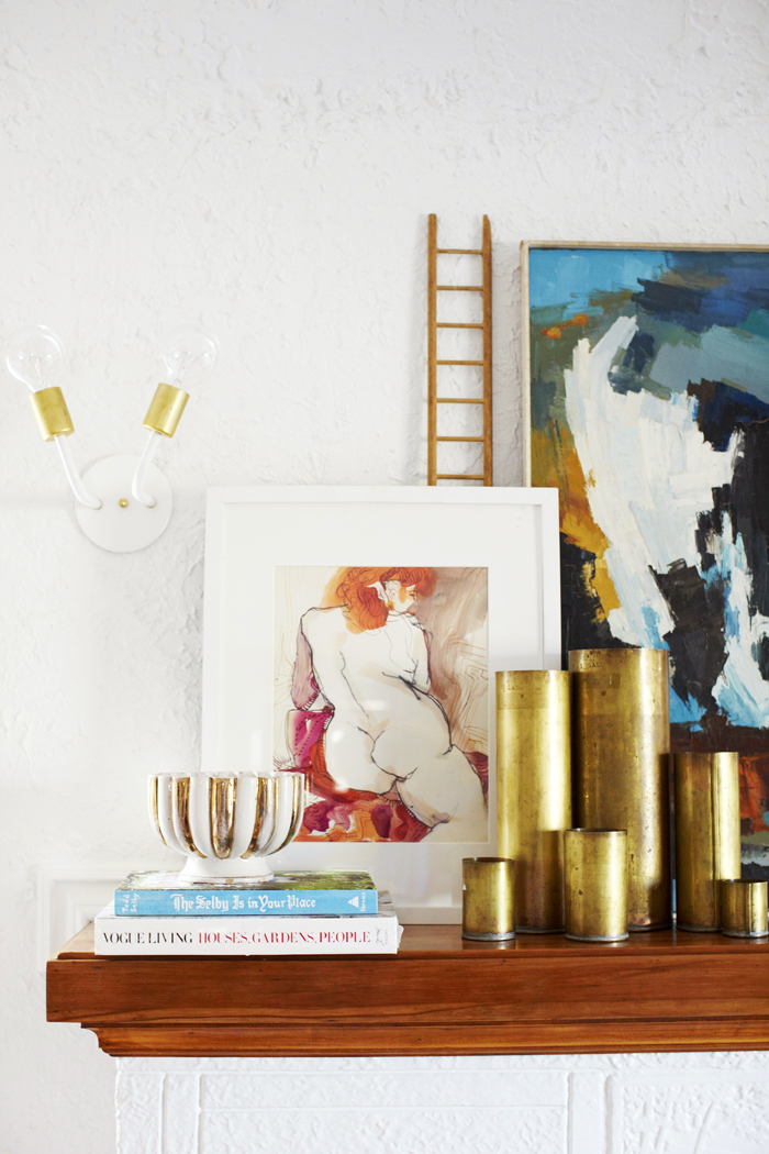 white and brass sconce